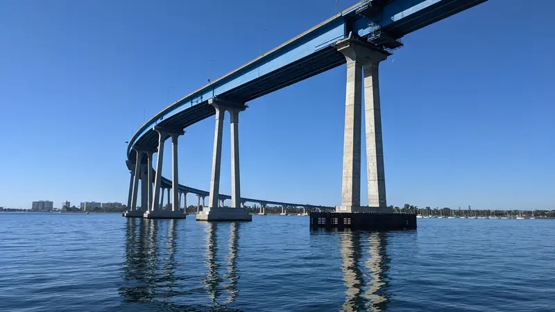 The San Diego to Coronado bridge curving over the calm blue bay